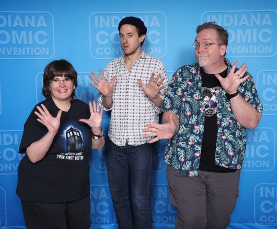 Us doing jazz hands with Arthur Darvill, who has a frightened expression, apropos of his "Doctor Who" character in his early episodes.